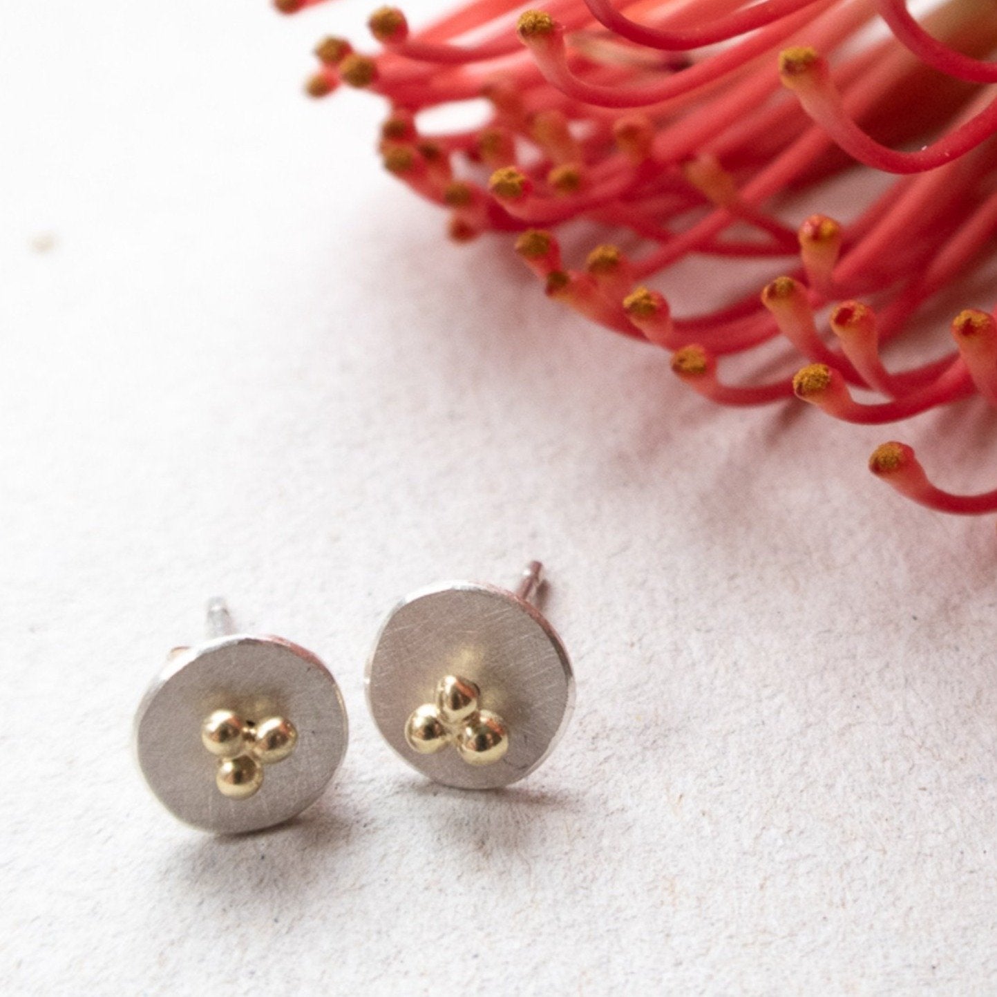 circle dot ear studs with 14k gold triple dots mezereem jewelry