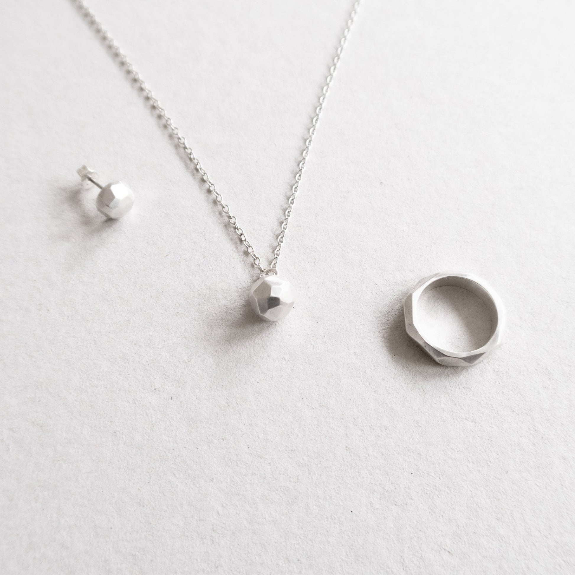 facet series, ring necklace and ear stud of mezereem jewelry