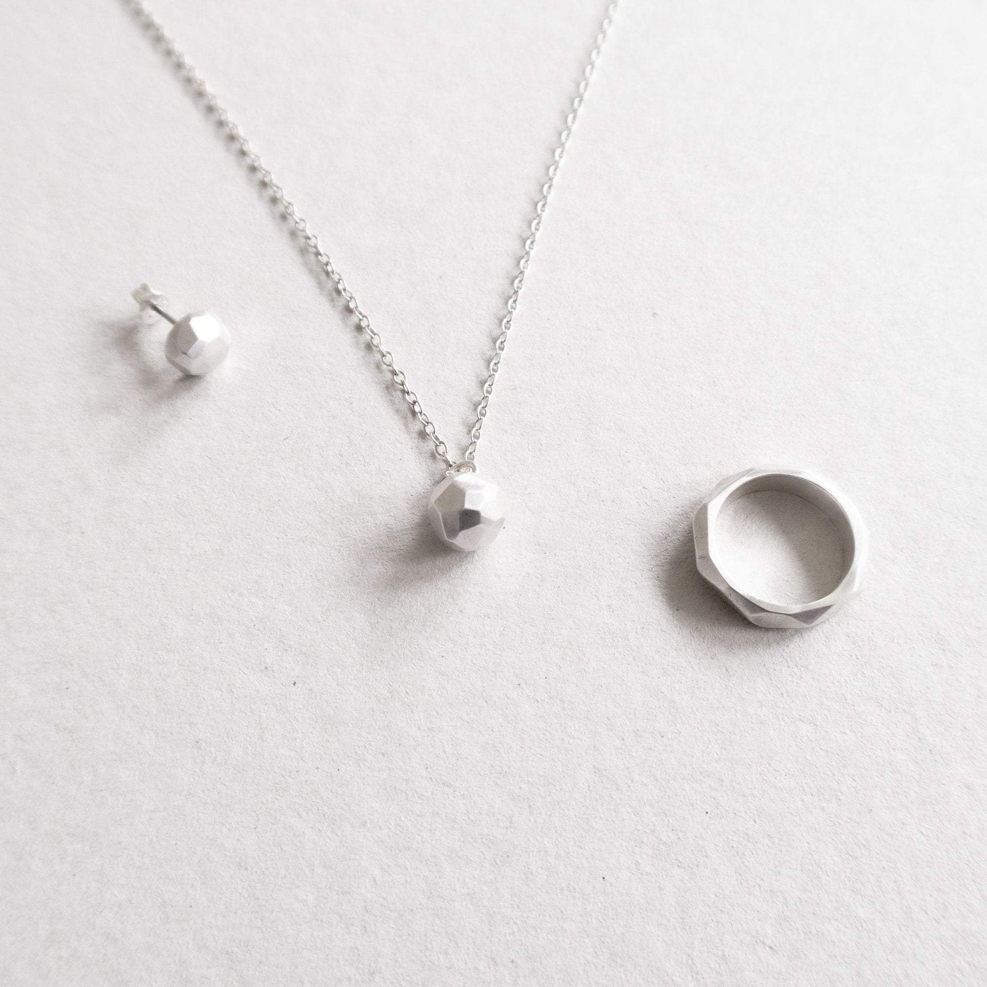 facet series ring, ear stud and pendant