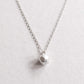silver facetted ball on necklace